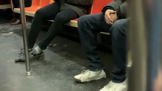 Guy sucks air out of canned air duster on subway train