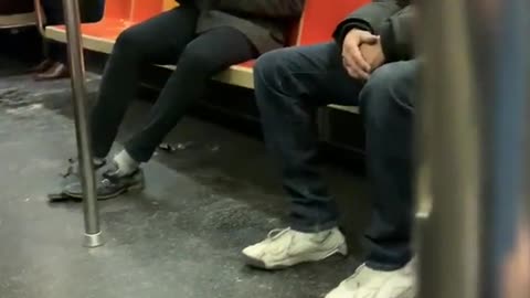 Guy sucks air out of canned air duster on subway train 