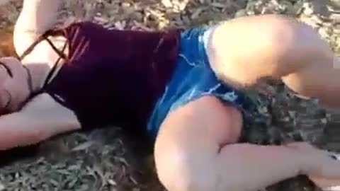 Jean shorts girl spins red playground bucket falls face