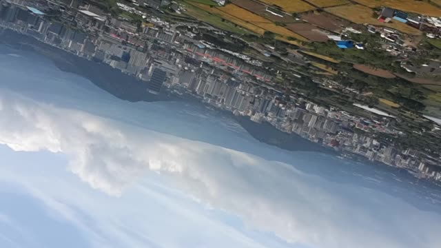 The scenery outside the window of an airplane landing