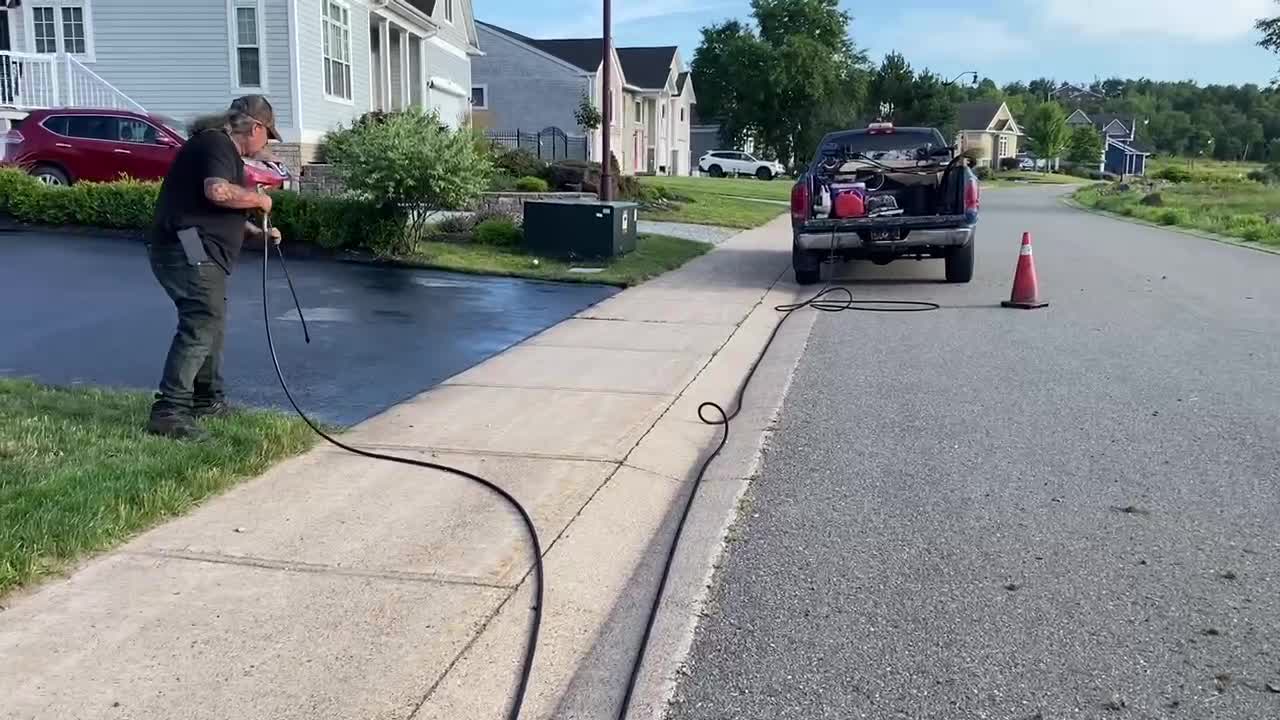 Professional Asphalt Spray Sealing: “The Shadow Man” Top Coats Pavement Maintenance