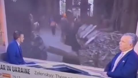 Wag the dog in Ukraine. Woman picks up part of the... set?