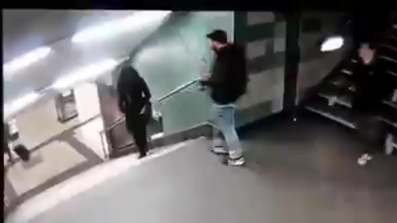 Outrageous. A migrant gang kicks a German girl down the stairs at a tube station