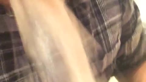 Guy in gray shirt throwing up in toilet