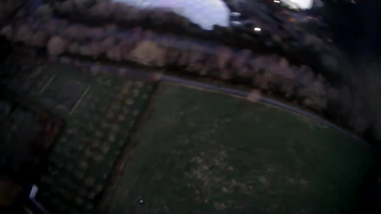 Fallow field and orchard opposite Eden Project biomes. SJRC Z5 Drone footage, low light, evening.