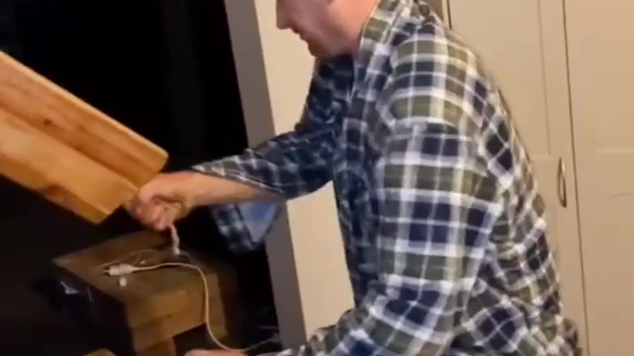 Opening a bottle with a chopping board