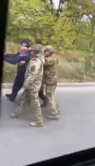 A disabled person with a walking cane gets nabbed for Zelensky's meat Grinder.