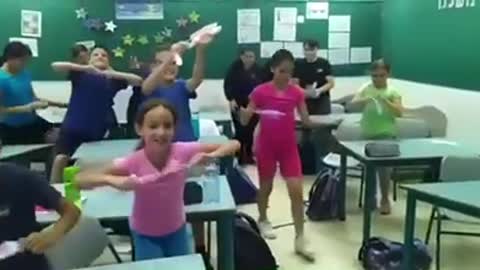 Watch what happens when a teacher tells her students that masks are no longer required in Israel.