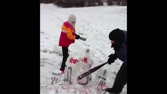 Kids destroy R2D2 snowman