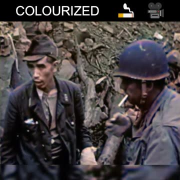 US Marine Shares a Cigarette with a Japanese Soldier on Iwo Jima -