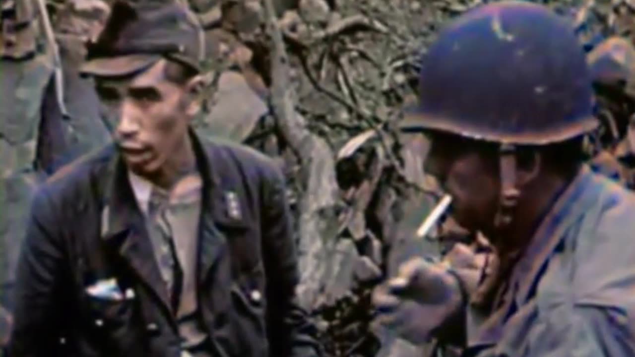 US Marine Shares a Cigarette with a Japanese Soldier on Iwo Jima -