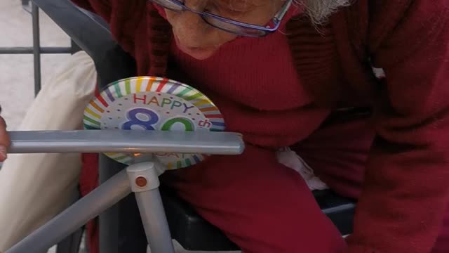 80-Year-Old Neighbor Blowing Out Sparkler Candles