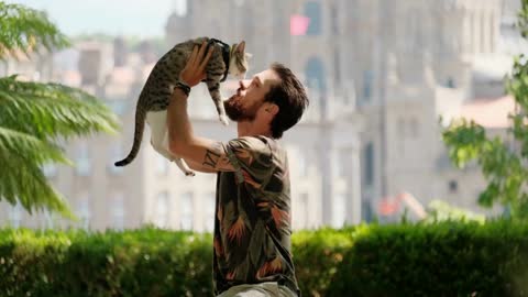 Young pilgrim with cat in Santiago de Compostela, Spanish town at the end of Camino de Santiago