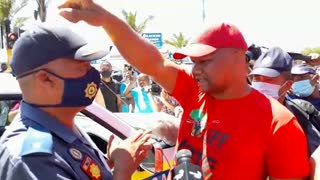 EFF members negotiate with SAPS to move their crowds closer to Brackenfell High School