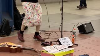Woman in black wig bobbing head music