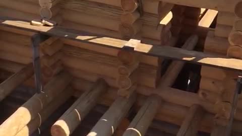 building a log house 2 with a view of China