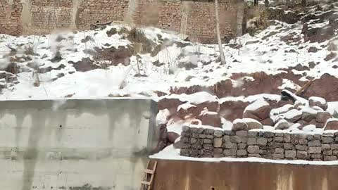 A beautiful view of snow on small mountains