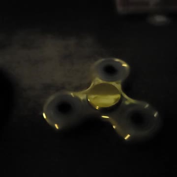 Gold fidget spinner super slow motion