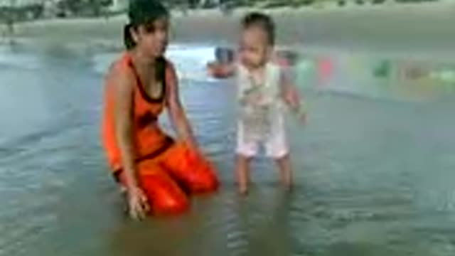 the moment of 12 months old baby walking on the signboard