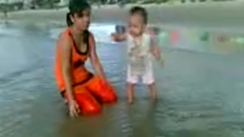 the moment of 12 months old baby walking on the signboard