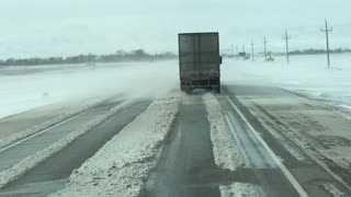 Heavy Winds Blow Trailer Around a Highway