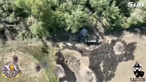 Ukrainian drone drops bomb into Russian tank open hatch with precision