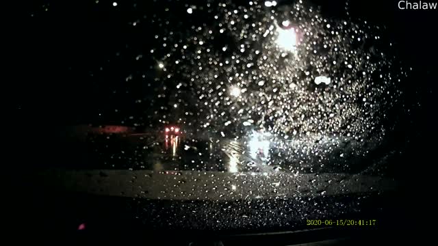 Power Wires Envelop Transport Truck on a Rainy Evening