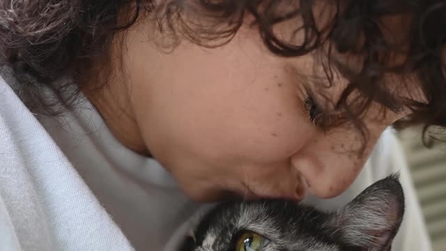 Woman Holding a Cat