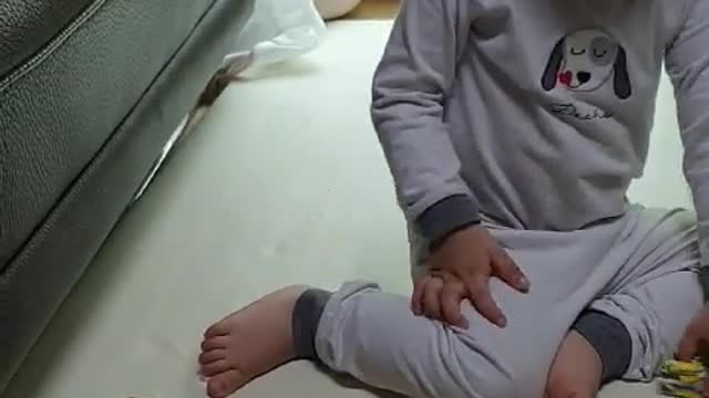 This is a video of a baby doing a puzzle.
