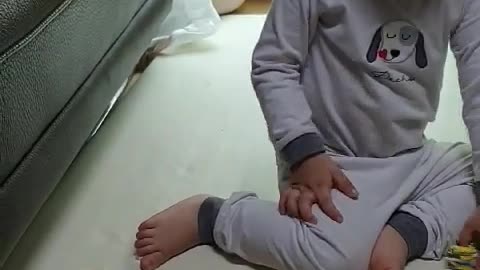 This is a video of a baby doing a puzzle.