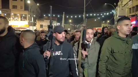 Hamas terrorists and their supporters marching in Jenin with weapons