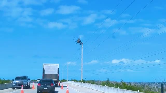WATCH : Worker Balance On Helicopter! 😲
