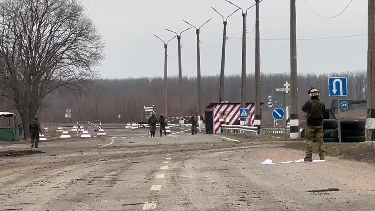 Donetsk People's Republic Militiamen removing the Ukrainian flag