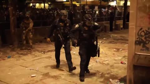 Portland Cop Limps Away After Being Injured By Rioters