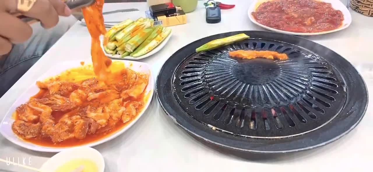 husband and wife take each other to eat bbq night in phan thiet, Việt Nam