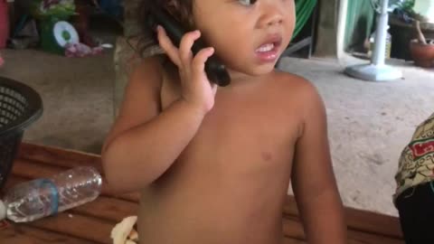 Adorable girl talking phone
