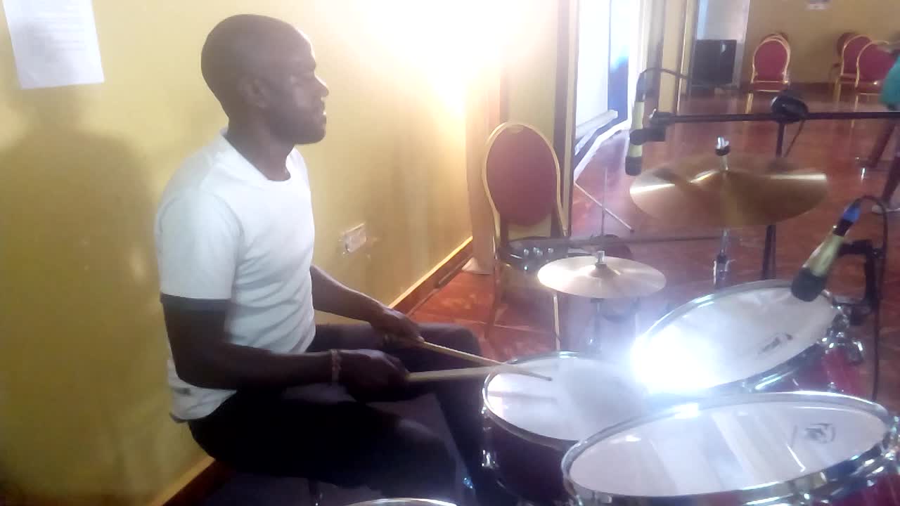 Simple praise African beat played in church.