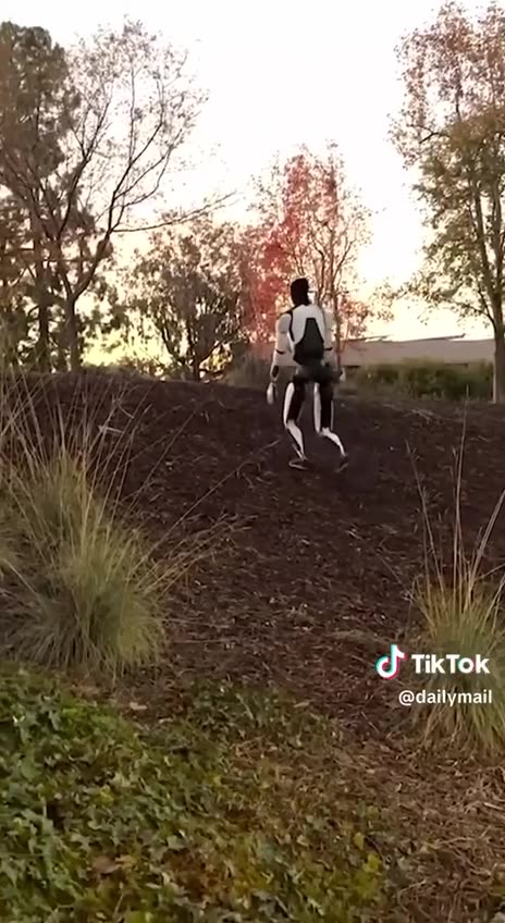 Teslas Optimus robot walks better than Joe Biden