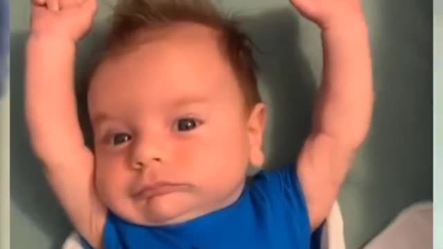 Funny baby laughing hysterically