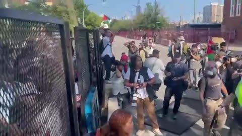 Protesters have taken down fence at the security perimeter around the DNC in Chicago