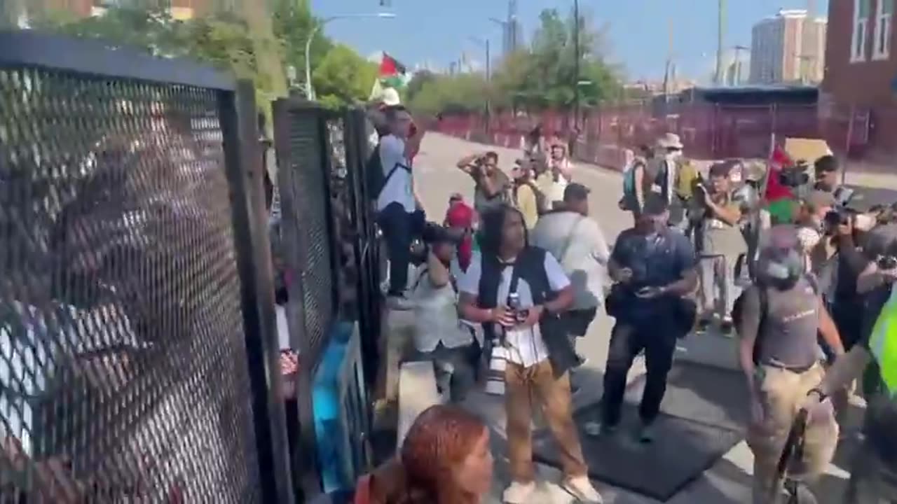 Protesters have taken down fence at the security perimeter around the DNC in Chicago