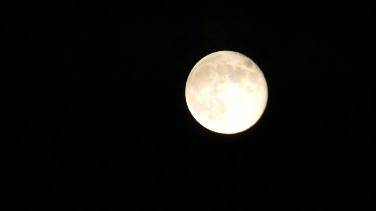 Clouds behind the Moon