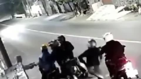 Motorbike robbers on the side of the road In Indonesia