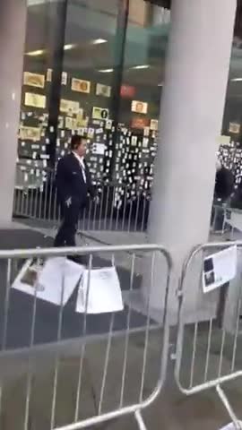 Stickers of the dead caused by the jabs are posted on windows of the BBC