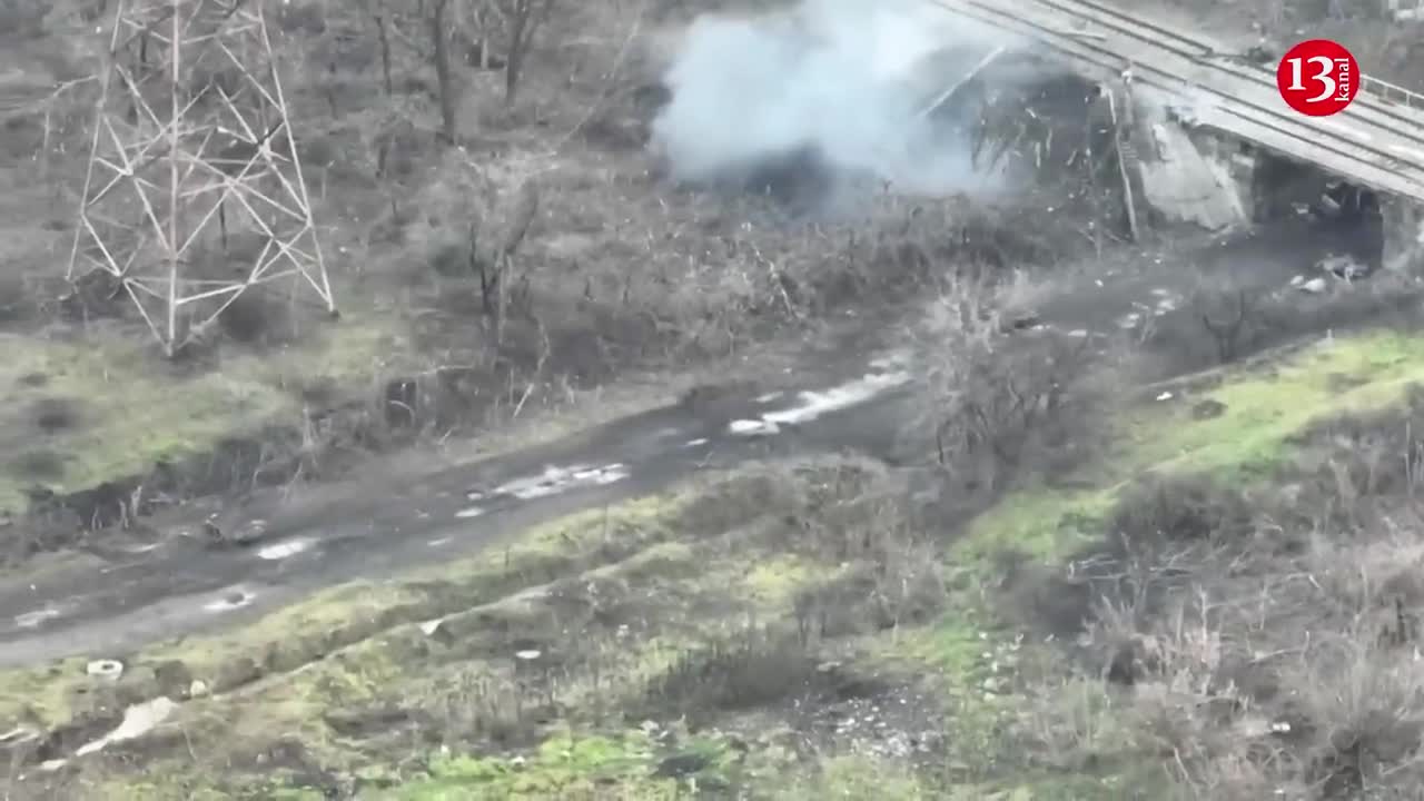 Russians gather the corpses of their dead soldiers and carry them as a garbage