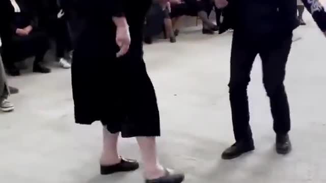 Woman lights up at a wedding