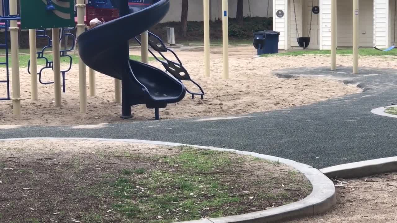 Girl doesn't want to leave park, goes painfully slow down slide