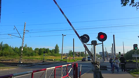 Railway crossing. Commuter EMU train. St. Petersburg-Ladozhsky/ Пригородный электропоезд. Петербург