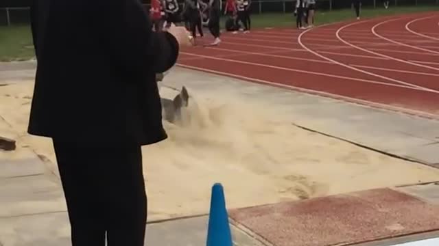 Guy Trips in Sand Pit While Attempting to Perform Long Jump