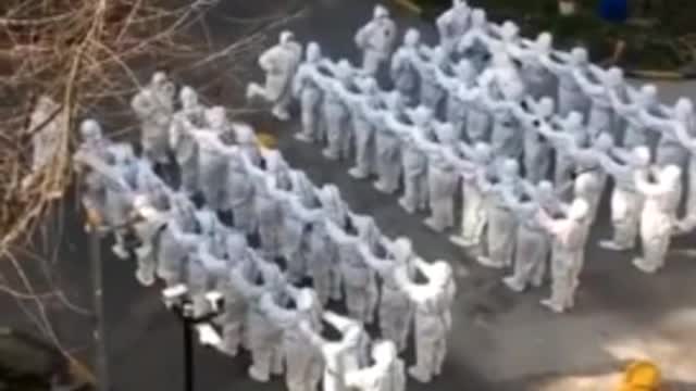 Chinese Stormtroopers Dance During Morning Call Before Going Door-to-Door to Perform COVID Tests